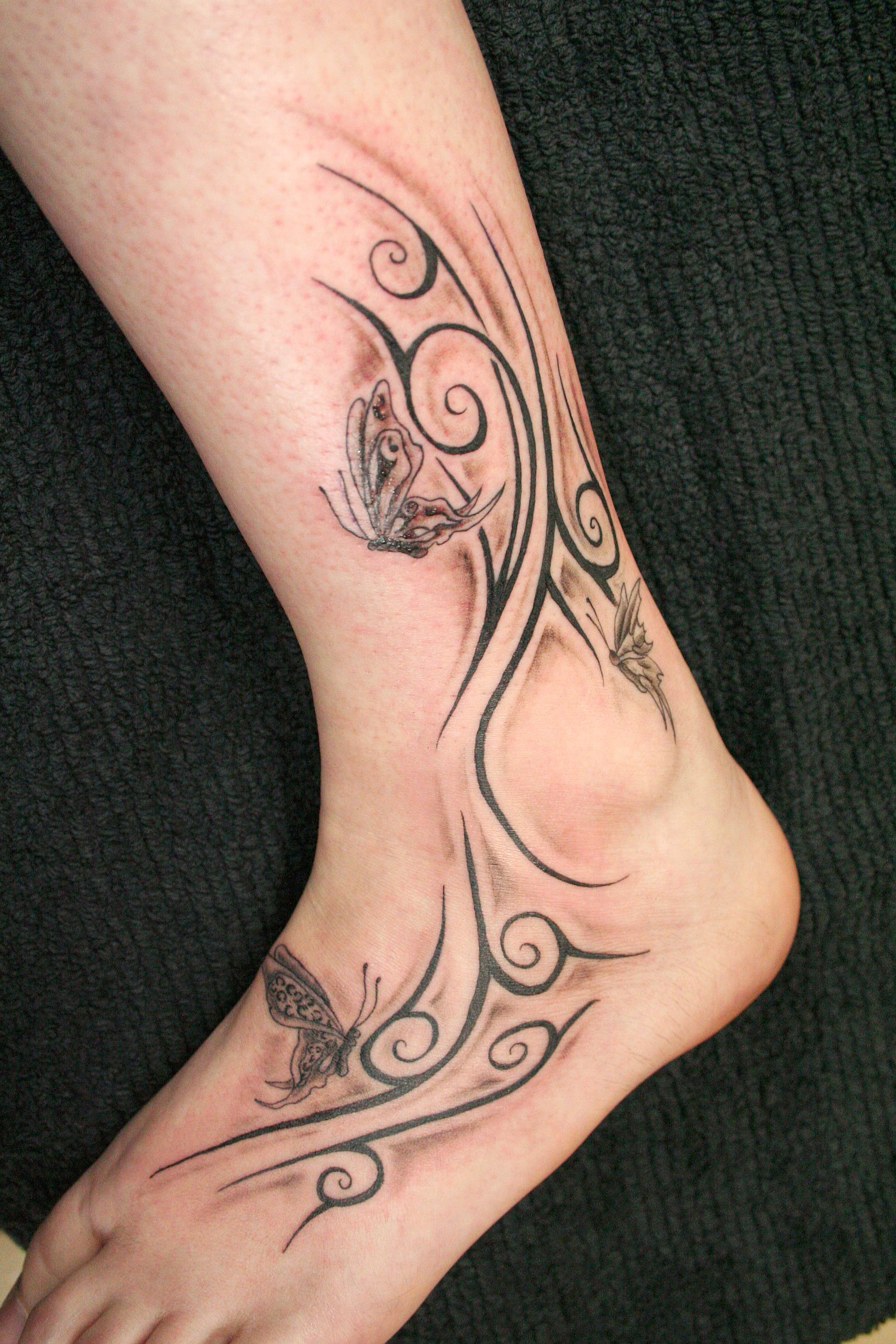 http://fc00.deviantart.com/fs24/f/2007/319/6/7/Butterflies_Tribal_Tattoo_by_2Face_Tattoo.jpg